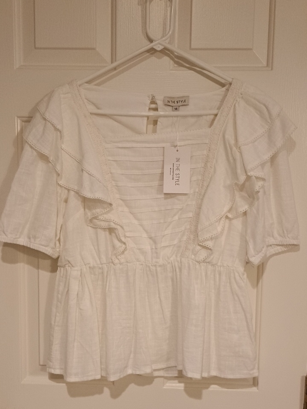 In The Style White Ruffle Peplum Blouse with Pintuck Front